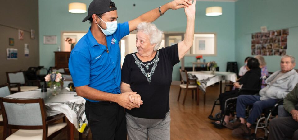 aged care Victoria - staff member dancing with resident